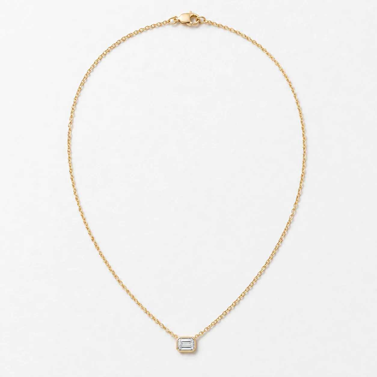 Bezel Moissanite Pendant with fine gold-tone chain