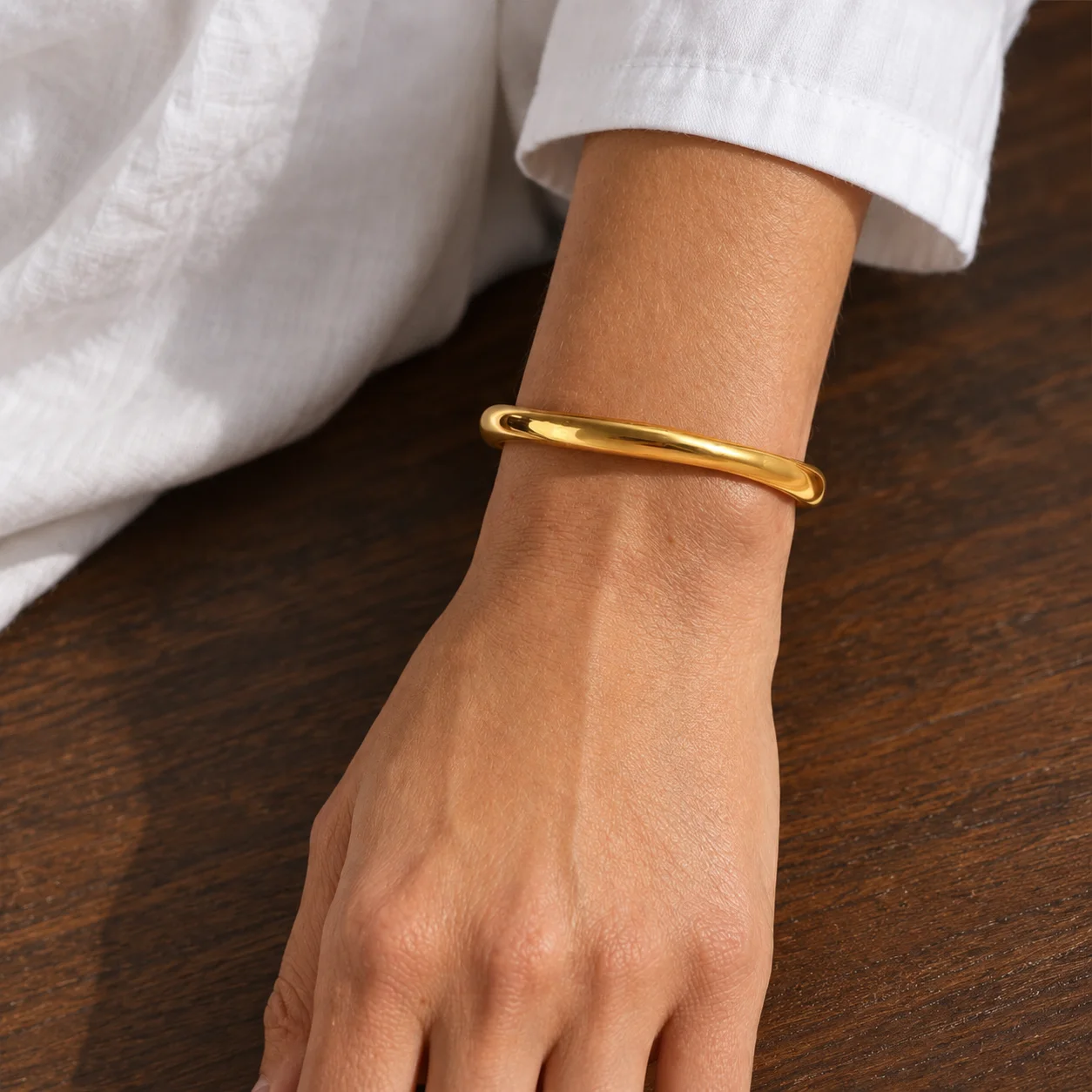 Sculpted Cuff worn on a wrist beside a white cotton sleeve